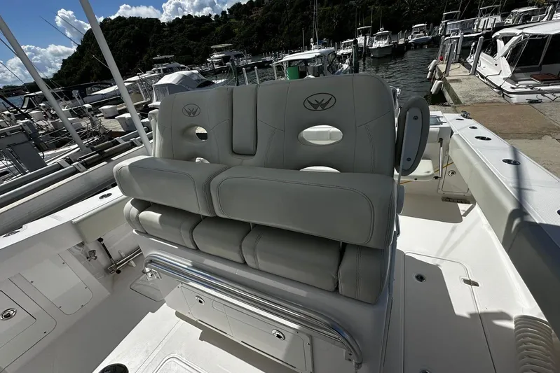  Yacht Photos Pics 2022 Southport 30 FE boat interior with cushioned seating at marina.