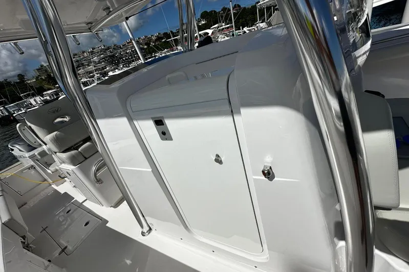  Yacht Photos Pics 2022 Southport 30 FE boat interior with sleek white console and seating.