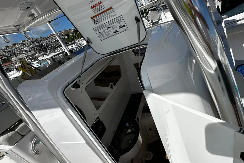  Yacht Photos Pics Interior view of 2022 Southport 30 FE boat, showcasing helm and seating area.