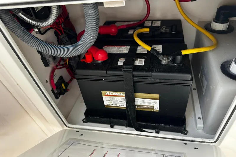  Yacht Photos Pics Battery compartment of a 2022 Southport 30 FE boat, featuring AC Delco batteries.