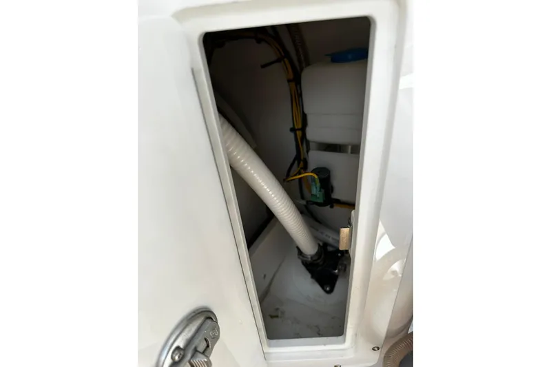  Yacht Photos Pics 2022 Southport 30 FE boat compartment with visible wiring and plumbing components.