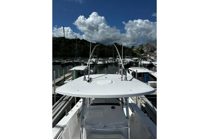  Yacht Photos Pics 2022 Southport 30 FE boat docked at marina under cloudy sky.