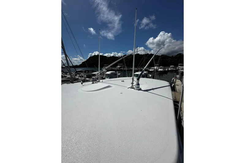  Yacht Photos Pics 2022 Southport 30 FE boat docked under a clear blue sky.