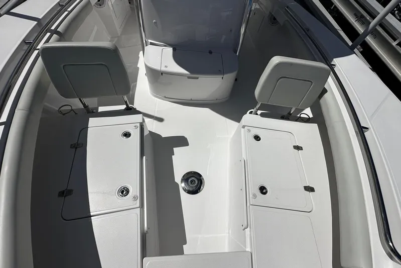  Yacht Photos Pics 2022 Southport 30 FE boat interior with seating and storage compartments.