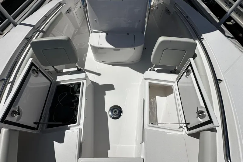  Yacht Photos Pics 2022 Southport 30 FE boat interior with open storage compartments and seating.