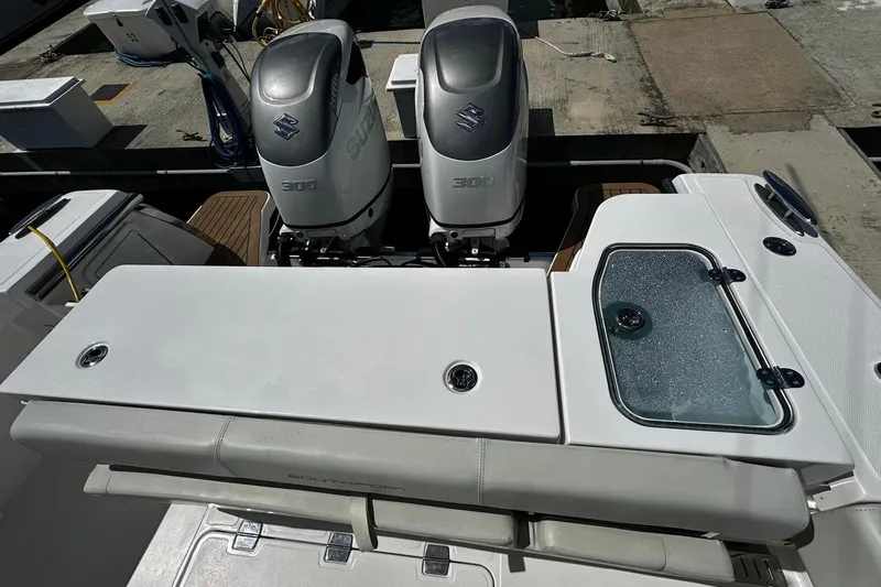  Yacht Photos Pics 2022 Southport 30 FE boat with dual Suzuki 300 engines at dock.