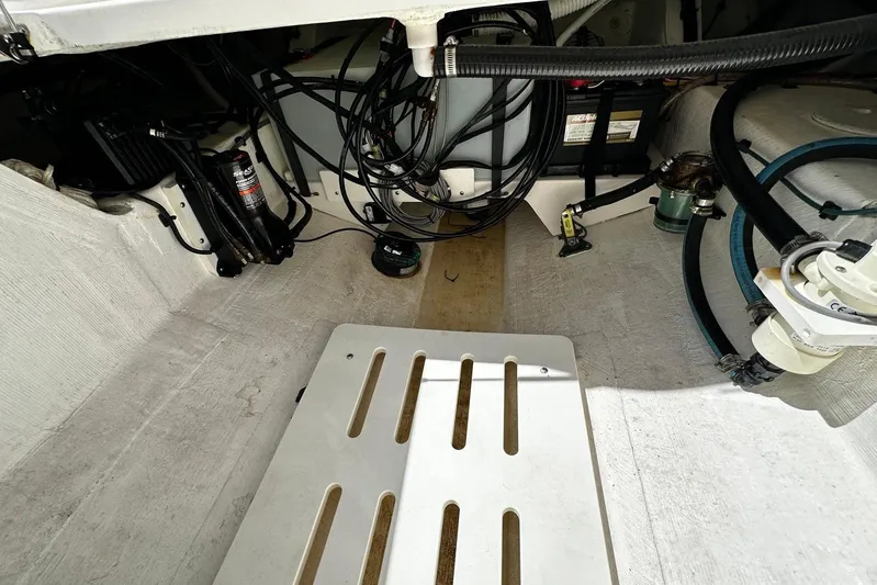  Yacht Photos Pics Engine compartment of a 2022 Southport 30 FE boat, showing wiring and components.