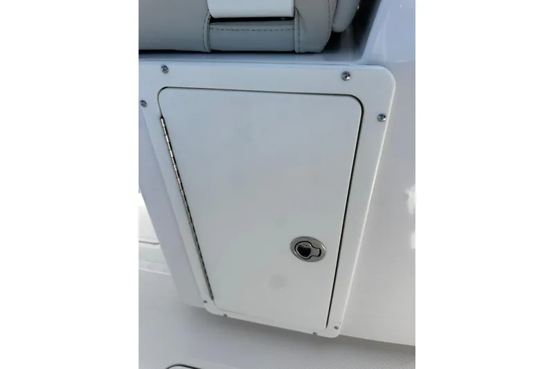  Yacht Photos Pics 2022 Southport 30 FE boat storage compartment with secure latch.