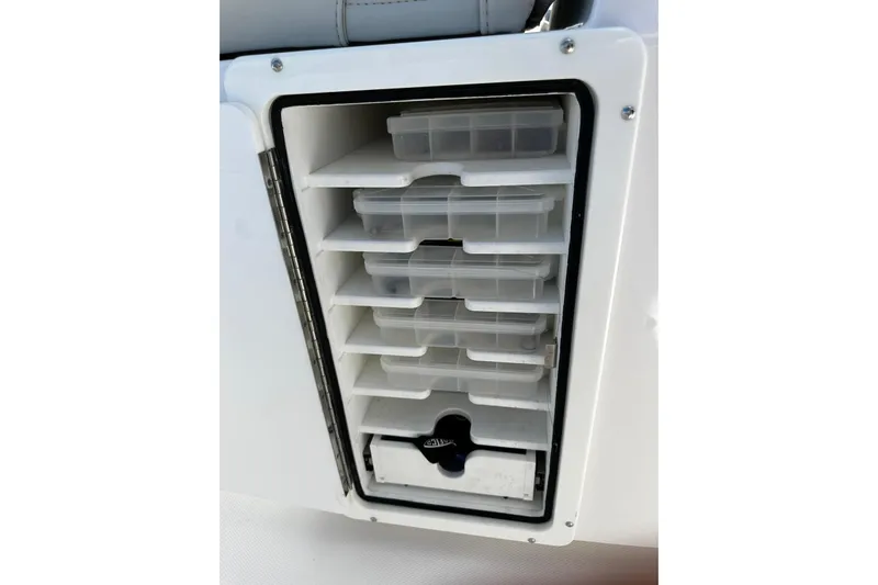  Yacht Photos Pics Storage compartment with organized trays on a 2022 Southport 30 FE boat.