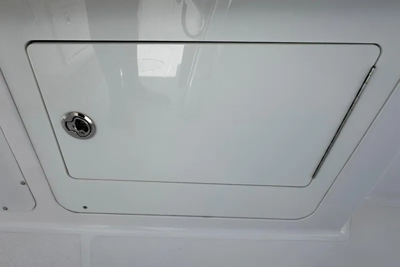  Yacht Photos Pics Hatch door on 2022 Southport 30 FE boat, featuring a secure lock mechanism.