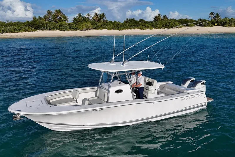  Yacht Photos Pics 2022 Southport 30 FE boat cruising near tropical island with clear blue water.