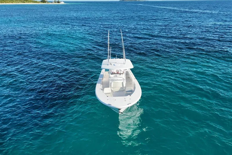  Yacht Photos Pics 2022 Southport 30 FE boat on clear blue ocean waters.