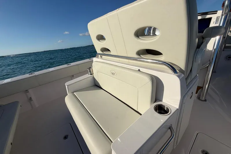  Yacht Photos Pics 2022 Southport 30 FE boat interior with cushioned seating and ocean view.