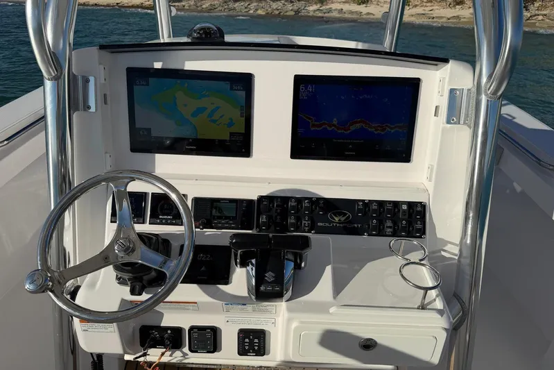  Yacht Photos Pics 2022 Southport 30 FE boat dashboard with dual screens and steering wheel.