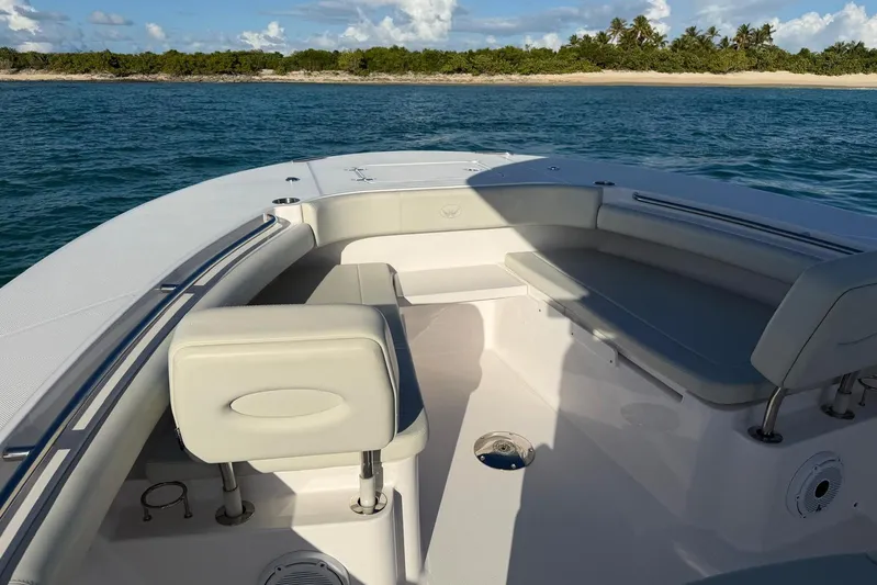  Yacht Photos Pics 2022 Southport 30 FE boat interior with seating, ocean view, and distant shoreline.