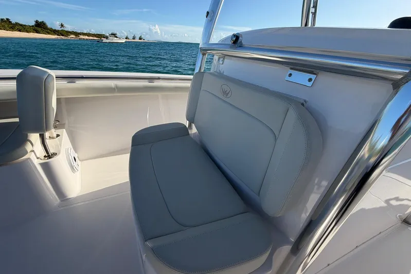  Yacht Photos Pics 2022 Southport 30 FE boat interior with cushioned seating, ocean view, and sunny weather.