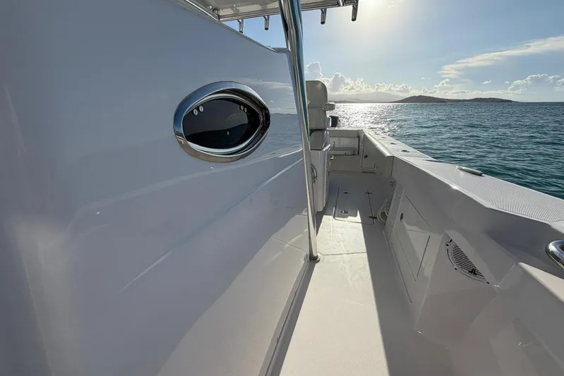  Yacht Photos Pics 2022 Southport 30 FE boat deck with ocean view and sunlight.