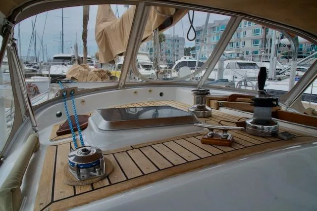 Sara Yacht Photos Pics Cockpit of a 1986 Passport 42 sailboat docked in a marina.