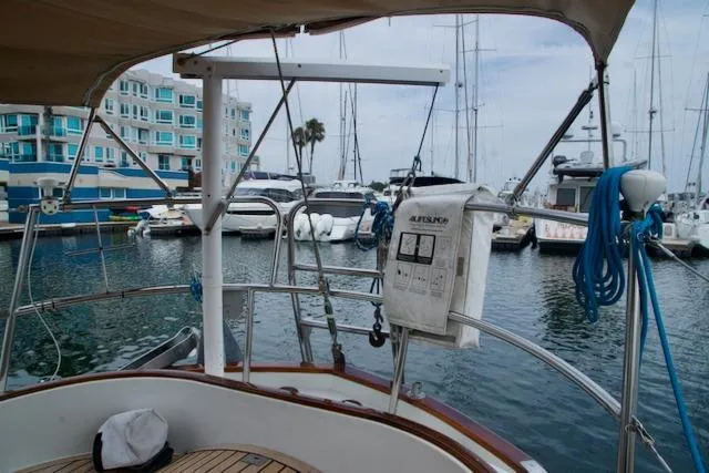 Sara Yacht Photos Pics Sailboat docked in marina, view from Passport 42, 1986 model, with nearby yachts and buildings.