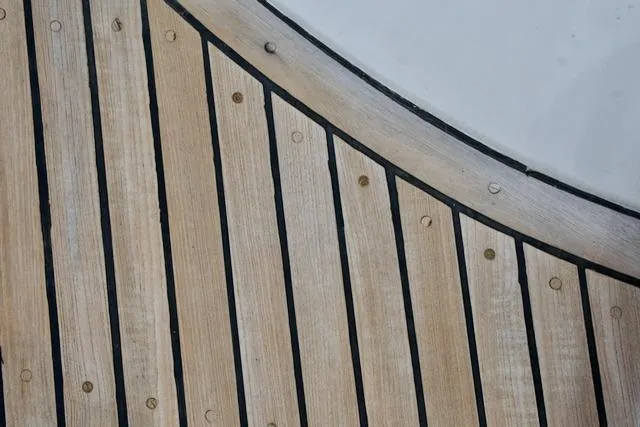 Sara Yacht Photos Pics Wooden deck with curved design on a 1986 Passport 42 yacht.