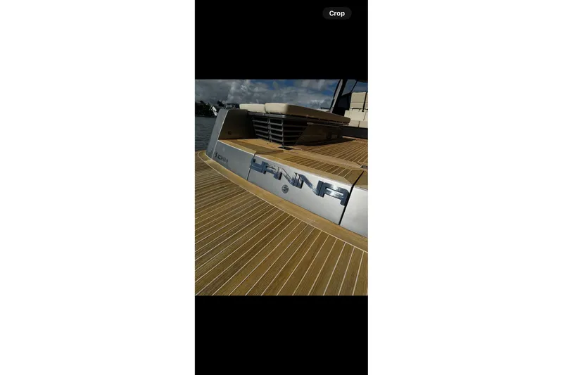 Yanina Yacht Photos Pics Luxury CNM 54 yacht deck, 2019 model, with sleek wooden finish.