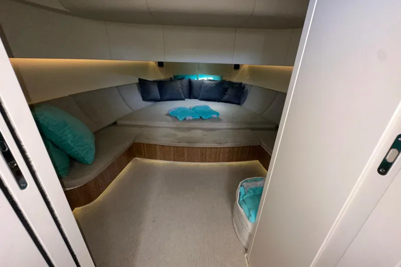 Yanina Yacht Photos Pics Luxurious interior of 2019 CNM 54 yacht with cozy seating and cushions.