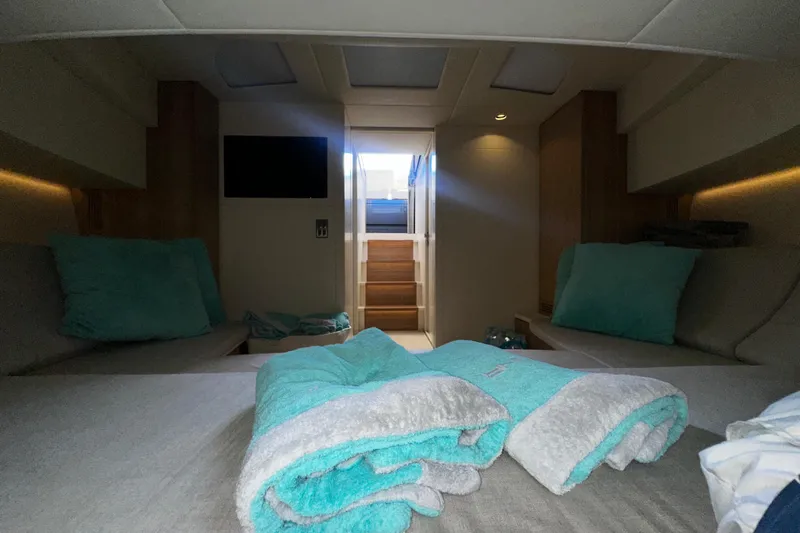 Yanina Yacht Photos Pics Luxurious CNM 54 yacht interior cabin with teal accents, 2019 model.