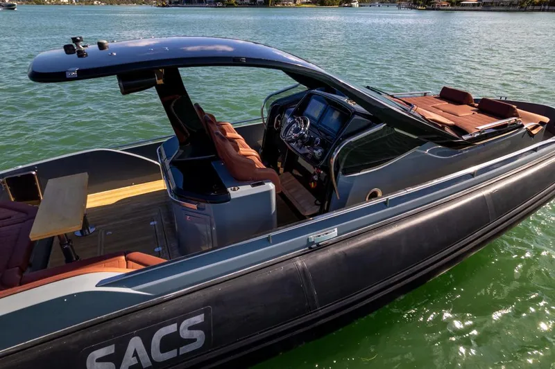 B-offline Yacht Photos Pics 2019 SACS Rebel 40 boat on water, featuring sleek design and luxurious seating.