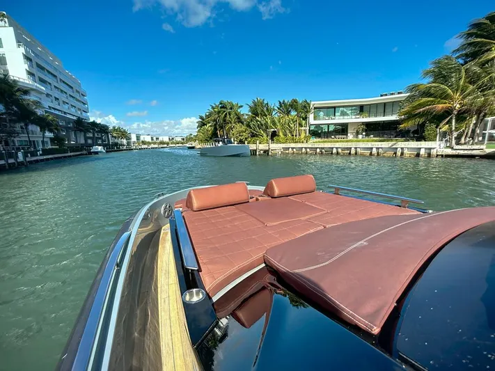 B-offline Yacht Photos Pics 2019 SACS Rebel 40 yacht cruising in a sunny, tropical canal setting.