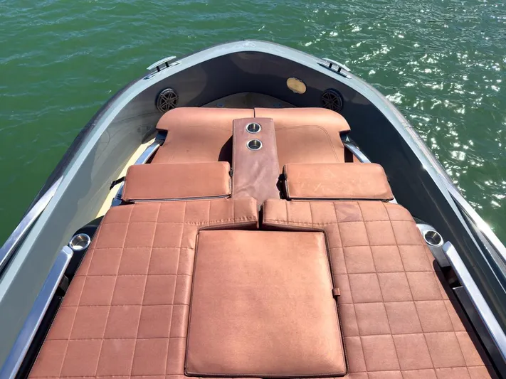 B-offline Yacht Photos Pics Luxurious 2019 SACS Rebel 40 boat with brown cushioned seating on calm water.