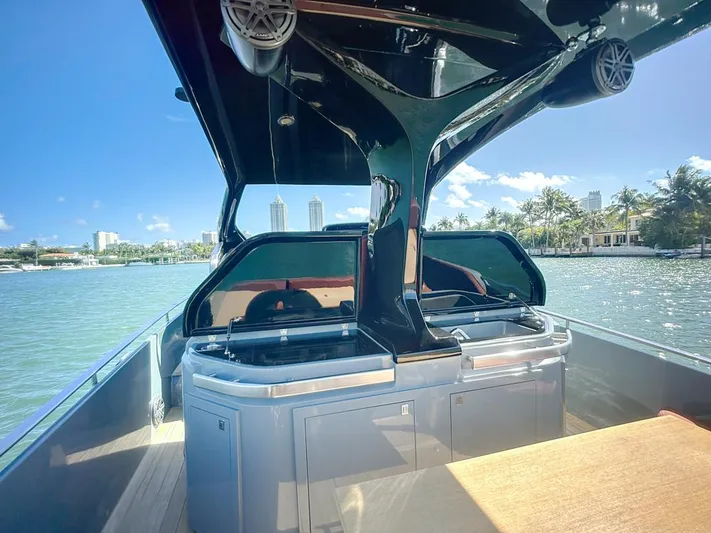 B-offline Yacht Photos Pics 2019 SACS Rebel 40 boat with sleek design on a sunny waterfront.