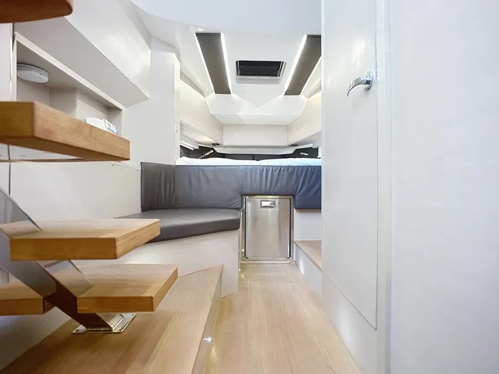 B-offline Yacht Photos Pics Modern interior of 2019 SACS Rebel 40 yacht with wooden stairs and sleek design.