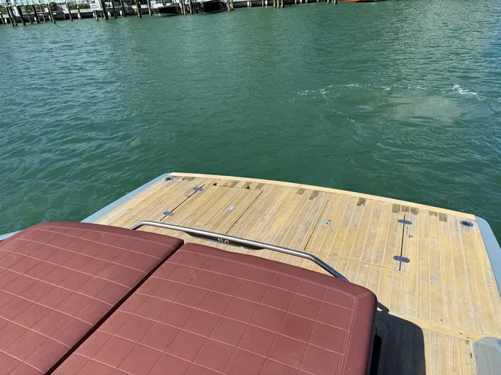 B-offline Yacht Photos Pics 2019 SACS Rebel 40 boat deck with brown seating, overlooking calm water.