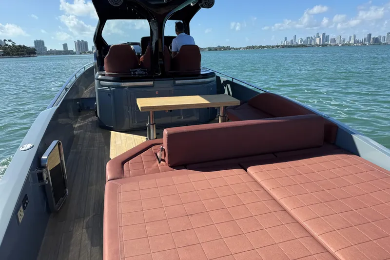 B-offline Yacht Photos Pics 2019 SACS Rebel 40 boat with spacious deck and seating, cruising on a sunny day.