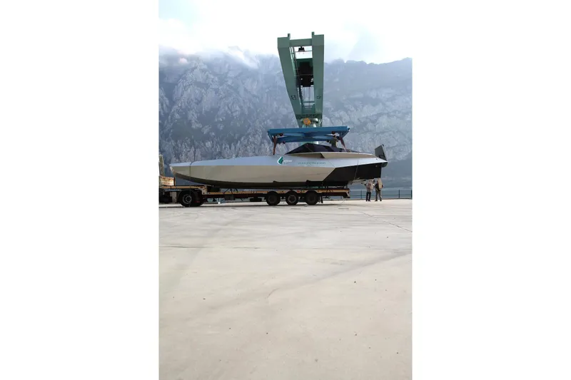 No Name Yacht Photos Pics 2025 Offshore Racing Code X boat on trailer with mountainous backdrop.