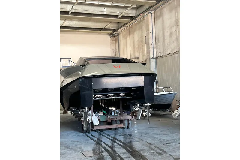 No Name Yacht Photos Pics 2025 Offshore Racing Code X boat in a workshop, rear view.