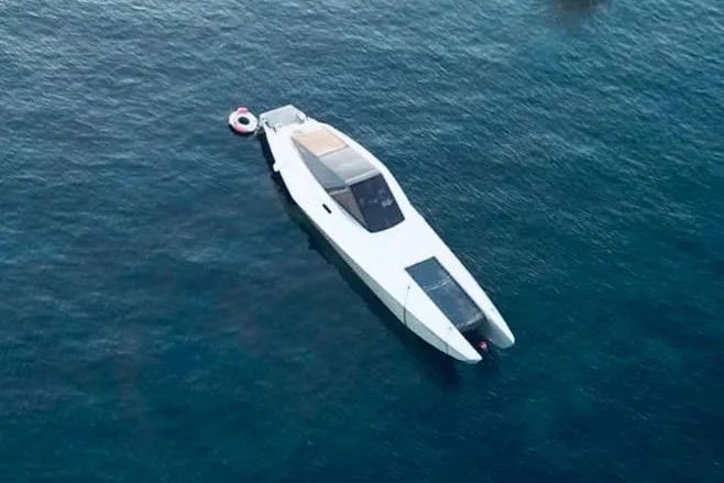 No Name Yacht Photos Pics 2025 Offshore Racing Code X boat on calm blue water, aerial view.