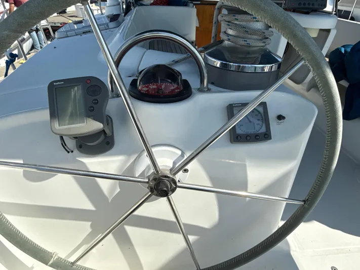 Gonzo Yacht Photos Pics Steering wheel and navigation instruments on a 1997 Beneteau 50 yacht.
