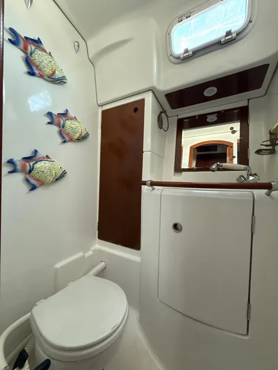 Gonzo Yacht Photos Pics Bathroom interior of 1997 Beneteau 50 yacht with nautical decor.