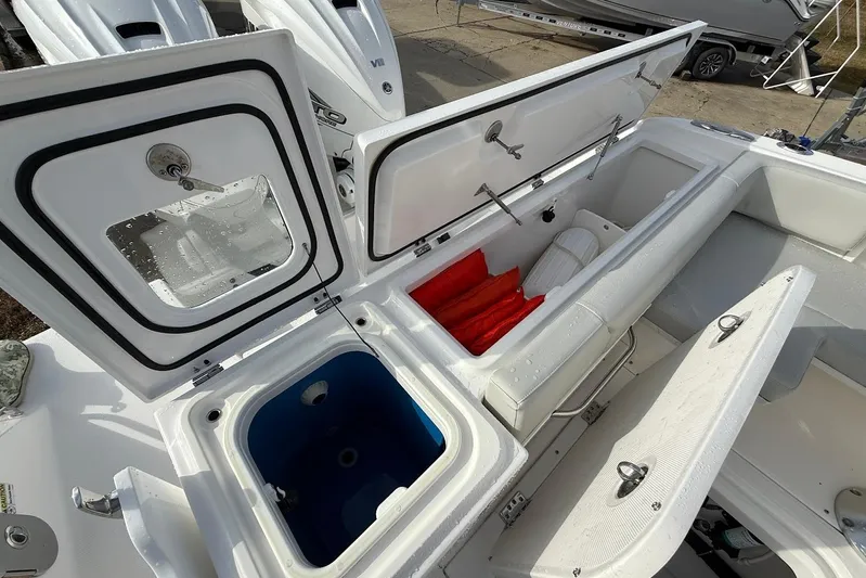 Untethered Yacht Photos Pics 2020 Everglades 340 Dual Console boat storage compartments and seating area.