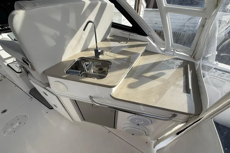 Untethered Yacht Photos Pics Interior of 2020 Everglades 340 Dual Console boat with sink and countertop.