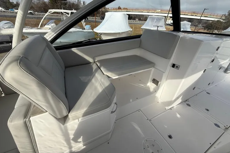 Untethered Yacht Photos Pics 2020 Everglades 340 Dual Console interior with gray seating and sleek design.
