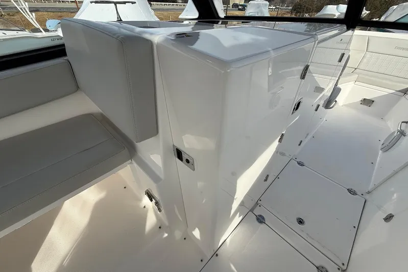 Untethered Yacht Photos Pics 2020 Everglades 340 Dual Console interior with seating and storage compartments.