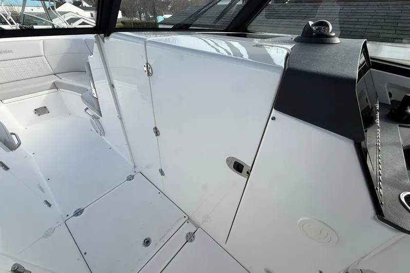 Untethered Yacht Photos Pics 2020 Everglades 340 Dual Console interior with sleek white seating and modern design.