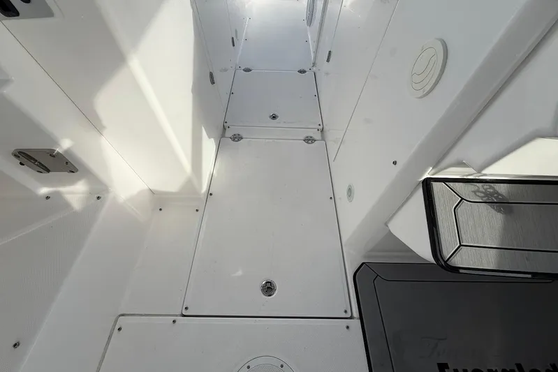 Untethered Yacht Photos Pics 2020 Everglades 340 Dual Console boat interior with sleek white flooring.