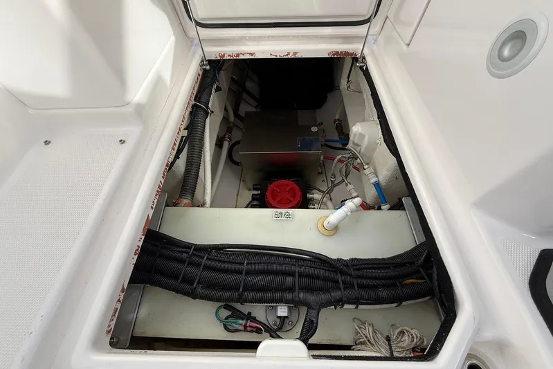 Untethered Yacht Photos Pics Engine compartment of 2020 Everglades 340 Dual Console boat, showing wiring and components.