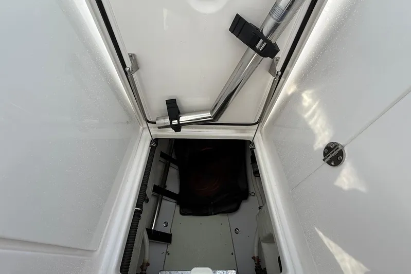 Untethered Yacht Photos Pics Storage compartment of 2020 Everglades 340 Dual Console boat, featuring secure latches and clean interior.