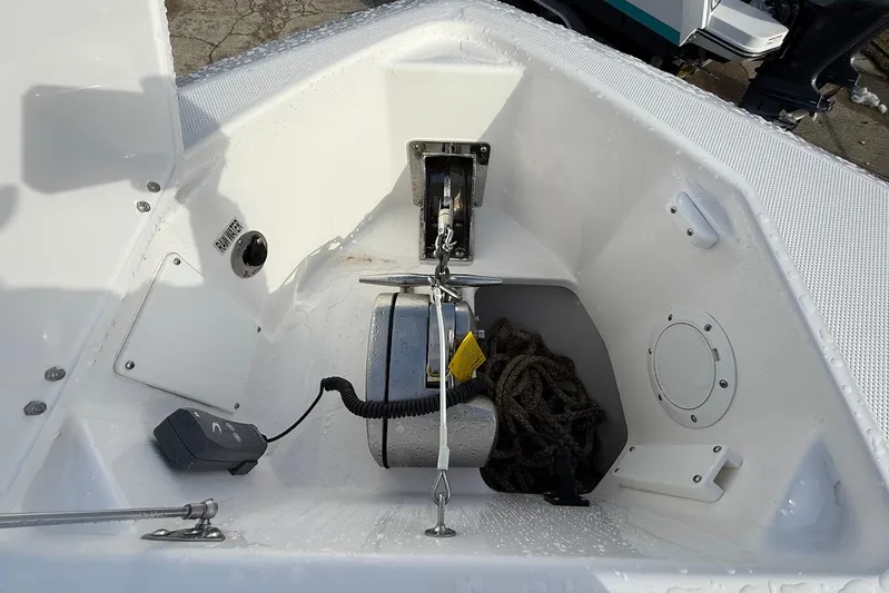 Untethered Yacht Photos Pics Bow anchor compartment of 2020 Everglades 340 Dual Console boat with rope and winch.
