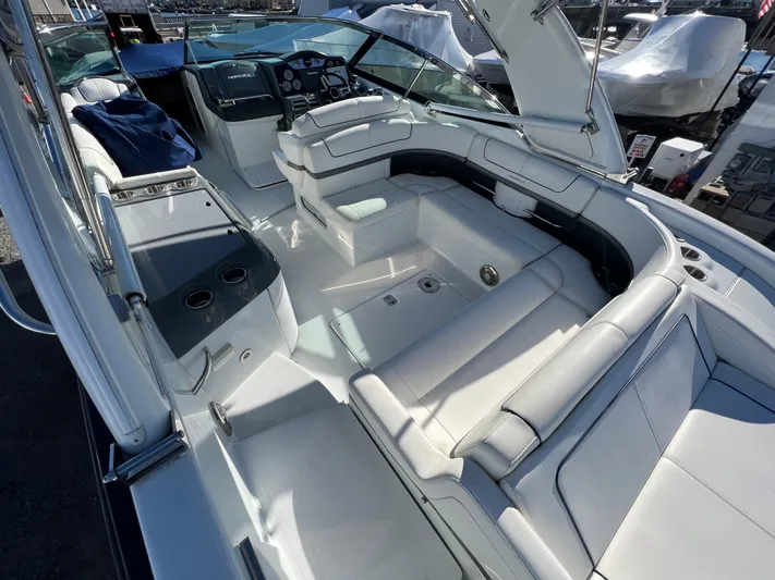  Yacht Photos Pics 2014 Formula 350 Crossover Bowrider interior with white seating and helm.