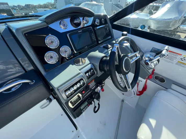  Yacht Photos Pics 2014 Formula 350 Crossover Bowrider dashboard with steering wheel and control panel.